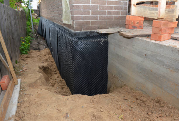 Happy homeowners after waterproofing job in West Falls